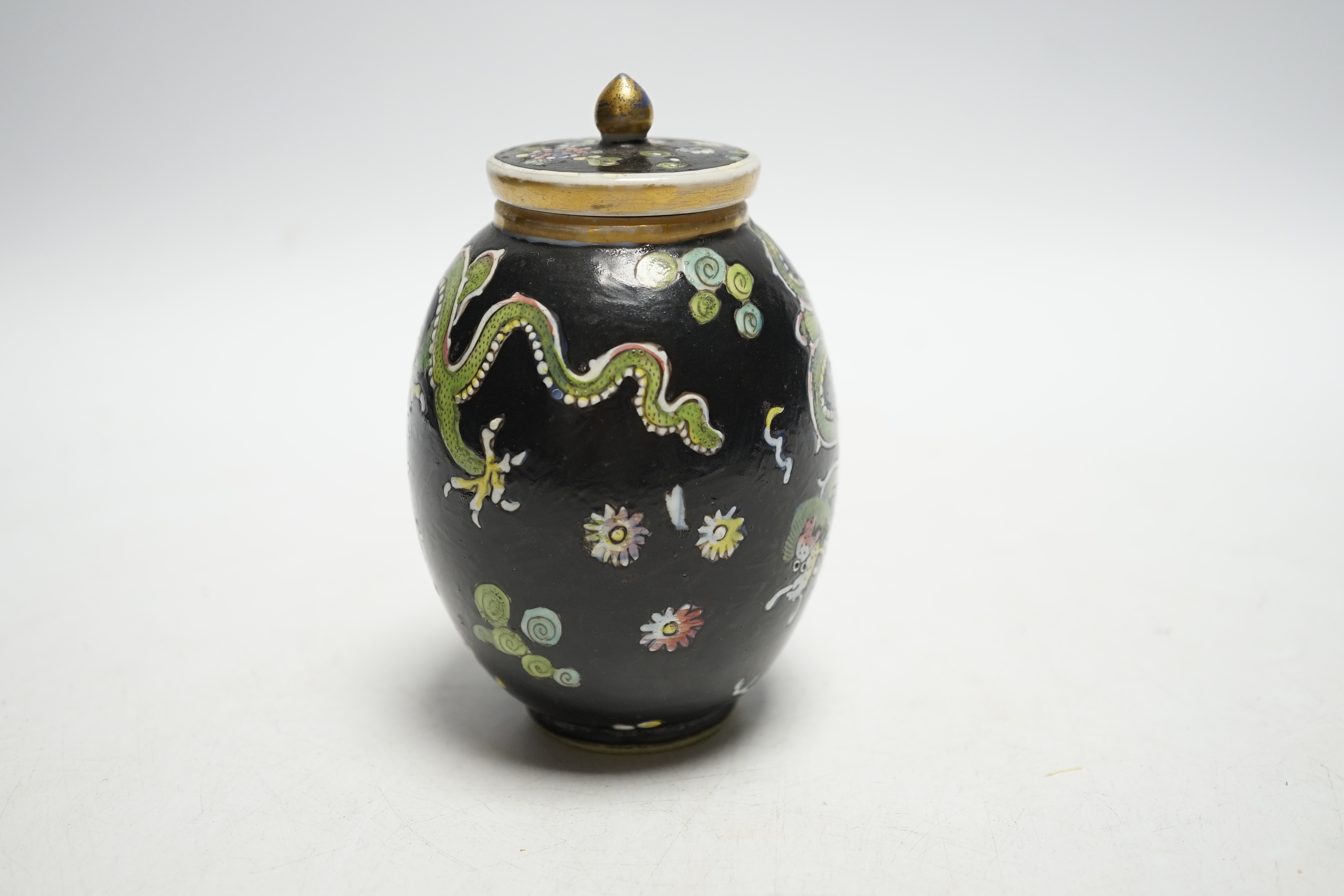 A Chinese Kangxi clobbered dragon jar and cover, 10cm high